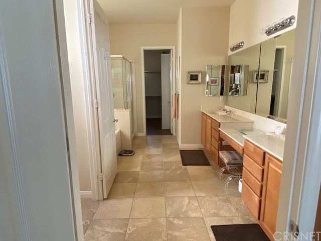80278 Camino San Mateo Indio, CA 92203 - Photo 25 of 63 a bathroom with a sink a mirror and a shower