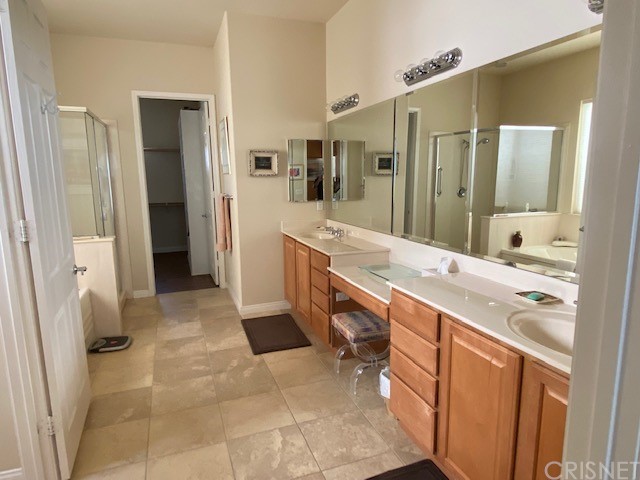 80278 Camino San Mateo Indio, CA 92203 - Photo 26 of 63 a bathroom with a sink a mirror and a shower