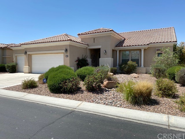 80278 Camino San Mateo Indio, CA 92203 - Photo 3 of 63 a front view of a house with a garden
