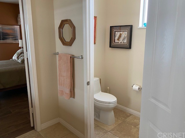 80278 Camino San Mateo Indio, CA 92203 - Photo 32 of 63 a bathroom with a toilet and a sink