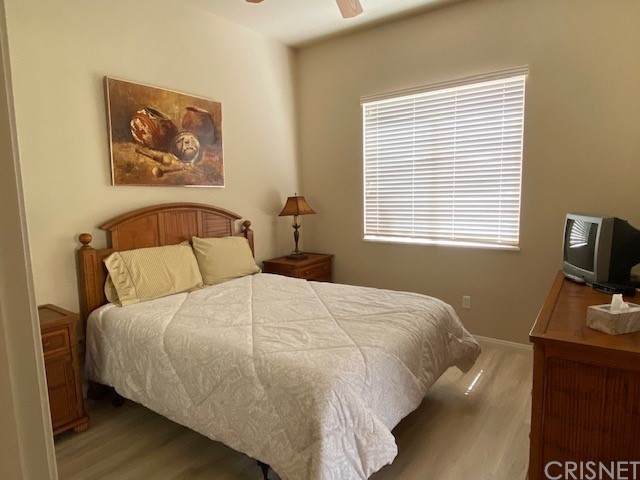 80278 Camino San Mateo Indio, CA 92203 - Photo 33 of 63 a bedroom with a bed and a flat tv screen on a dresser