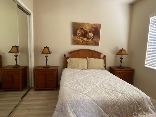 80278 Camino San Mateo Indio, CA 92203 - Photo 34 of 63 a bedroom with a bed and a painting on the wall