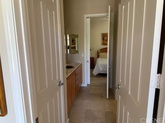 a bathroom with a sink and cabinets