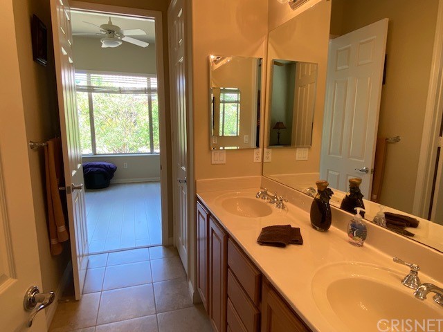 80278 Camino San Mateo Indio, CA 92203 - Photo 37 of 63 a bathroom with a double vanity sink and a mirror