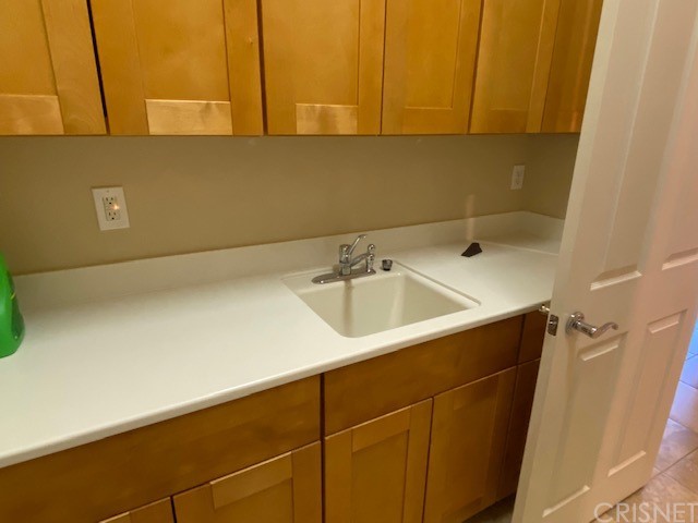 80278 Camino San Mateo Indio, CA 92203 - Photo 42 of 63 a bathroom with a sink and cabinets