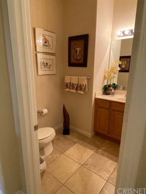 80278 Camino San Mateo Indio, CA 92203 - Photo 44 of 63 a bathroom with a toilet a sink a vanity and mirror
