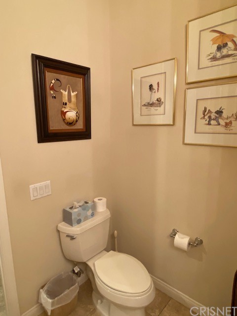 80278 Camino San Mateo Indio, CA 92203 - Photo 45 of 63 a white toilet sitting next to a bathroom sink