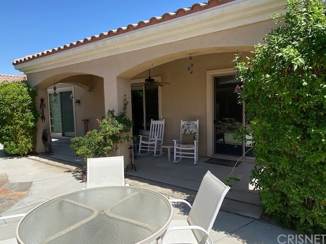80278 Camino San Mateo Indio, CA 92203 - Photo 50 of 63 a view of a house with a chairs in patio