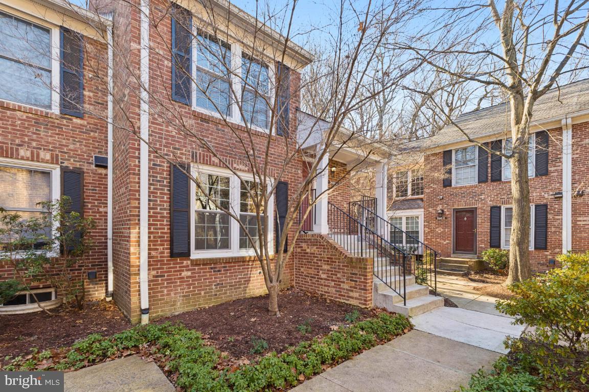 2452 South Walter Reed Drive, Unit 3 Arlington, VA 22206 - Photo 2 of 32 a view of a brick building next to a yard
