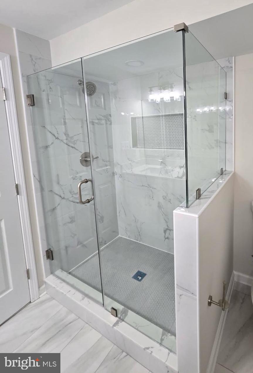 2452 South Walter Reed Drive, Unit 3 Arlington, VA 22206 - Photo 24 of 32 a bathroom with a shower and a sink