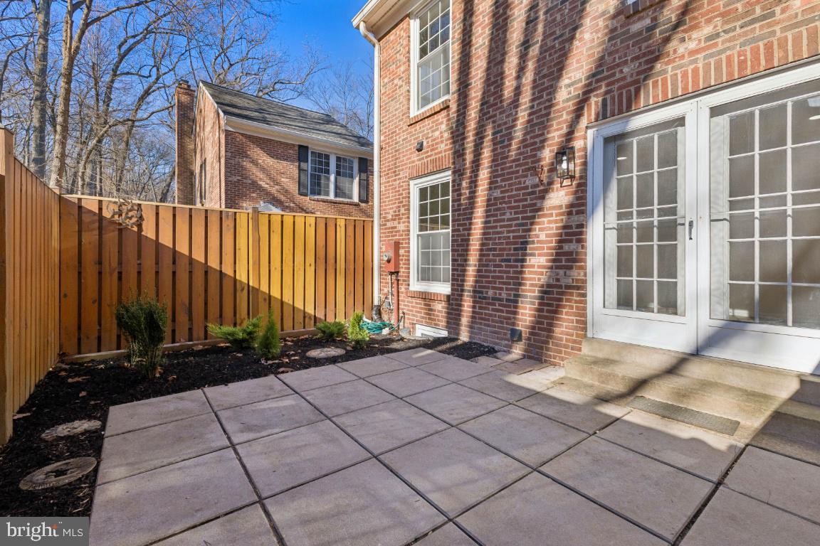 2452 South Walter Reed Drive, Unit 3 Arlington, VA 22206 - Photo 25 of 32 a front view of a house with a yard