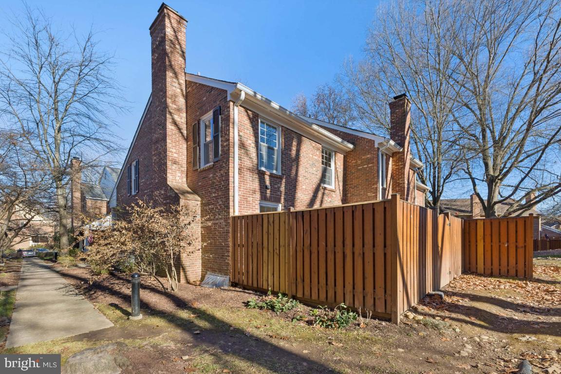 2452 South Walter Reed Drive, Unit 3 Arlington, VA 22206 - Photo 27 of 32 a view of a house with a wooden fence
