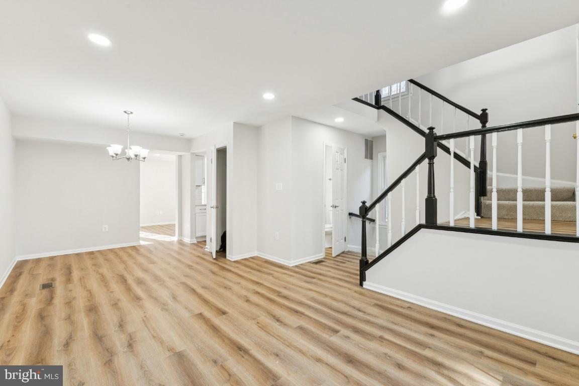 2452 South Walter Reed Drive, Unit 3 Arlington, VA 22206 - Photo 3 of 32 a view of an empty room with stairs