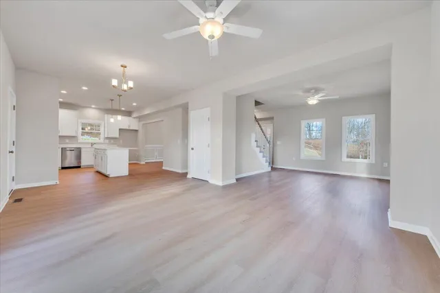a view of a kitchen and a kitchen with a stove top oven