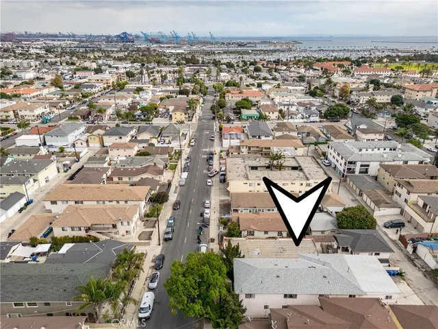 an aerial view of a residential houses with outdoor space