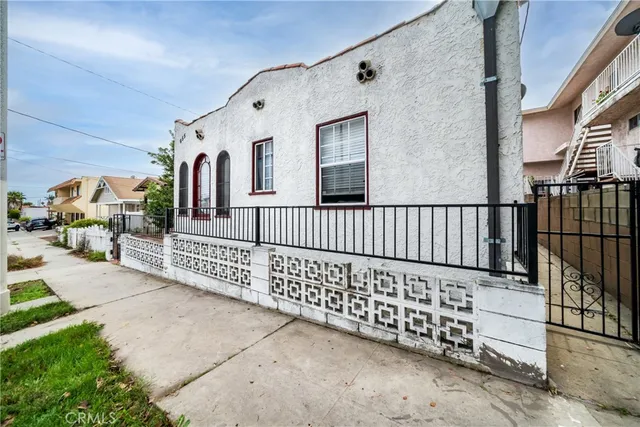 a view of a porch with wooden fence