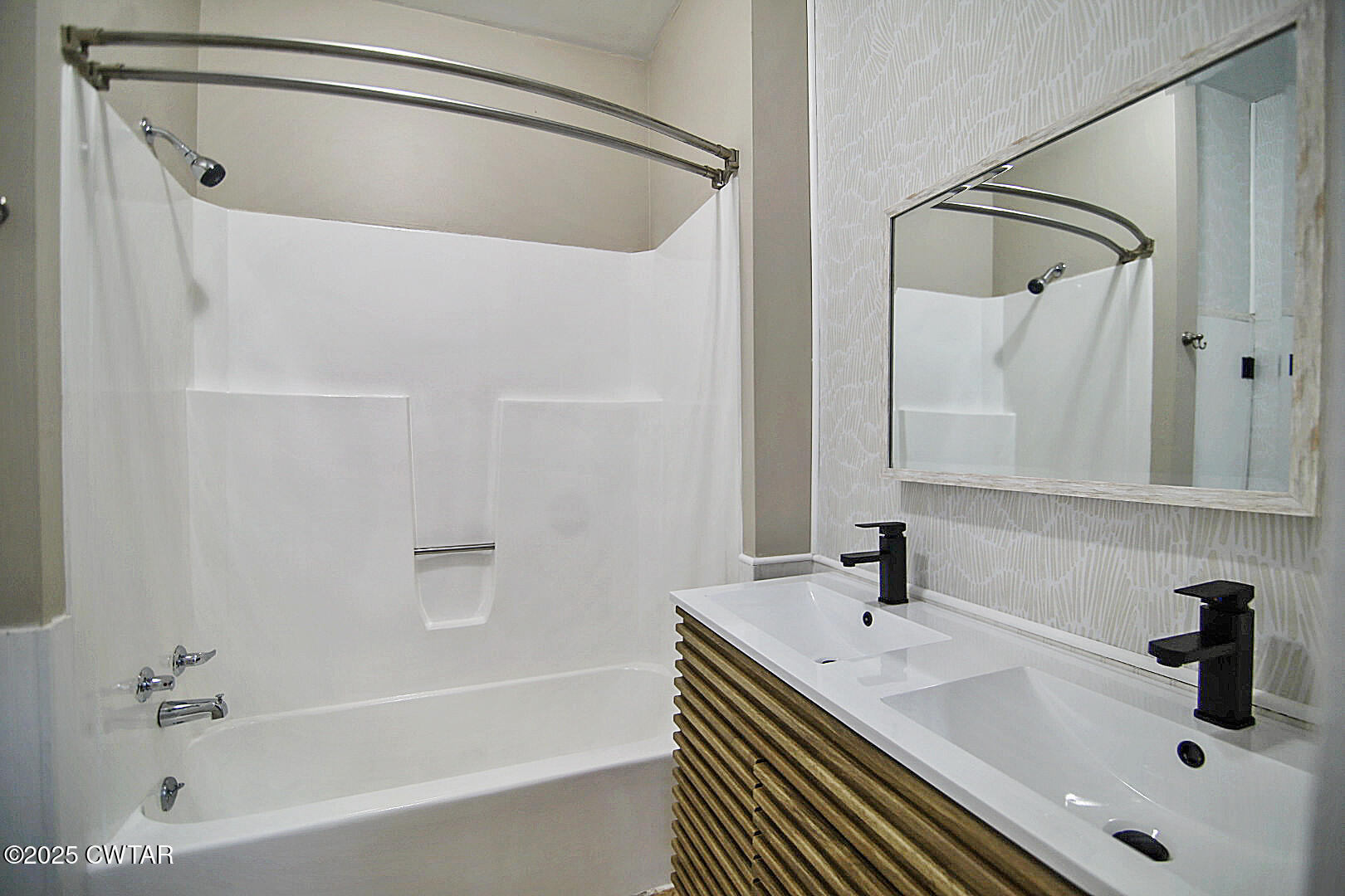 2354 Beech Bluff Road Jackson, TN 38301 - Photo 12 of 18 a bathroom with a sink a mirror and a shower