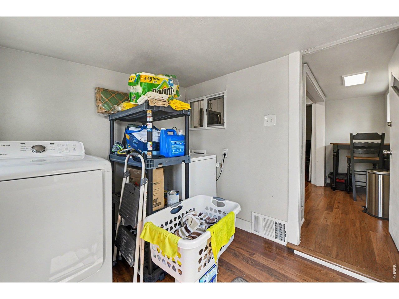 427 9th Street Greeley, CO 80631 - Photo 18 of 22 a utility room with dryer washer and a view of living room