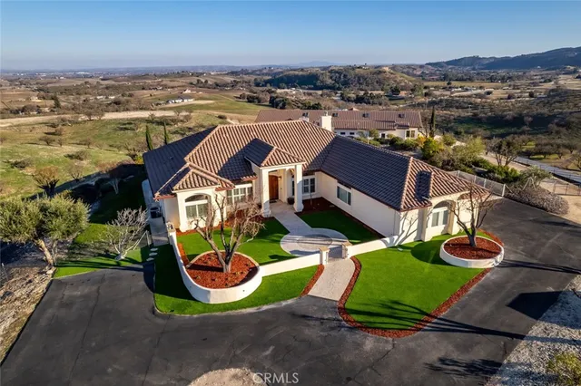 an aerial view of a house with a ocean view