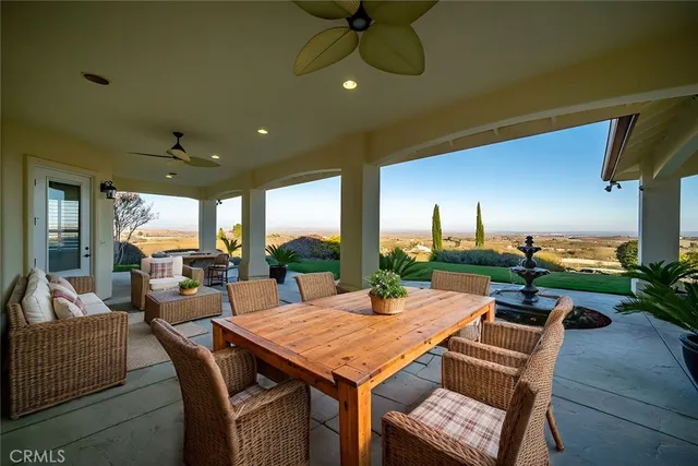 a view of a house with pool and a yard