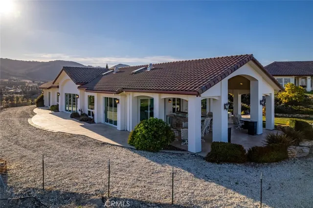 a very nice looking dining room with a large glass table and chairs