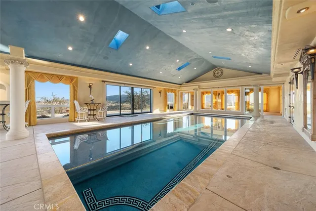 a lobby with furniture and floor to ceiling window