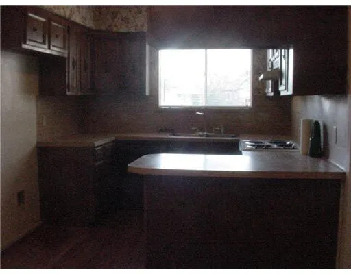 a close view of sink and cabinets