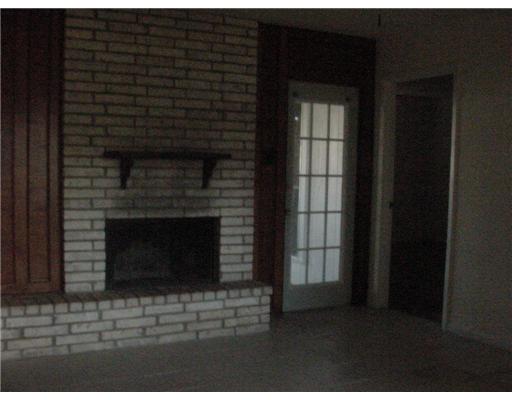1402 Madrid Circle Portland, TX 78374 - Photo 3 of 3 a living room with a fireplace