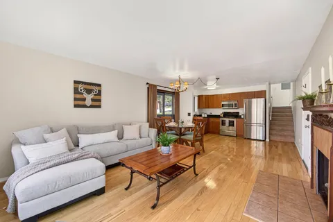 a living room with furniture and a table