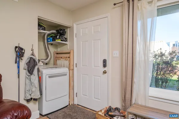 a view of storage and utility room with a window