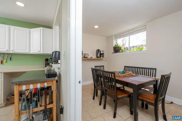 a view of a dining room with furniture and window