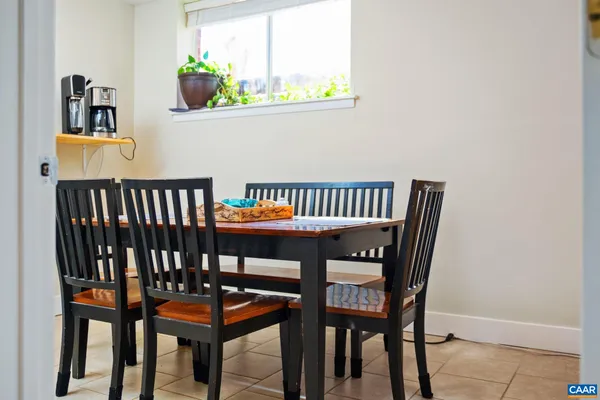 a view of a dining room with furniture and window