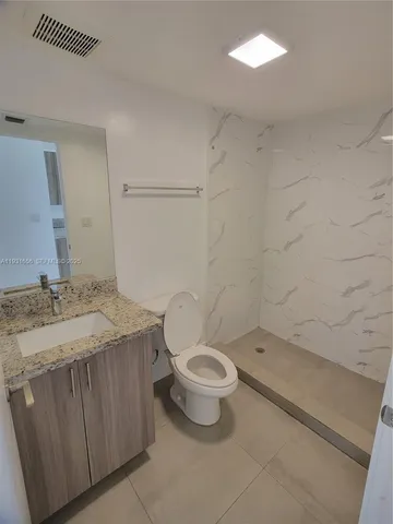 an empty room with closet area