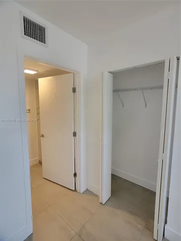 a bathroom with a granite countertop toilet a sink and a shower