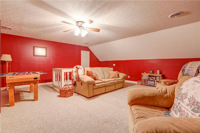 906 Swindle Road Lafayette, TN 37083 - Photo 14 of 21 This bonus room is great for being used as a man cave, playroom, media room, or all of the above!