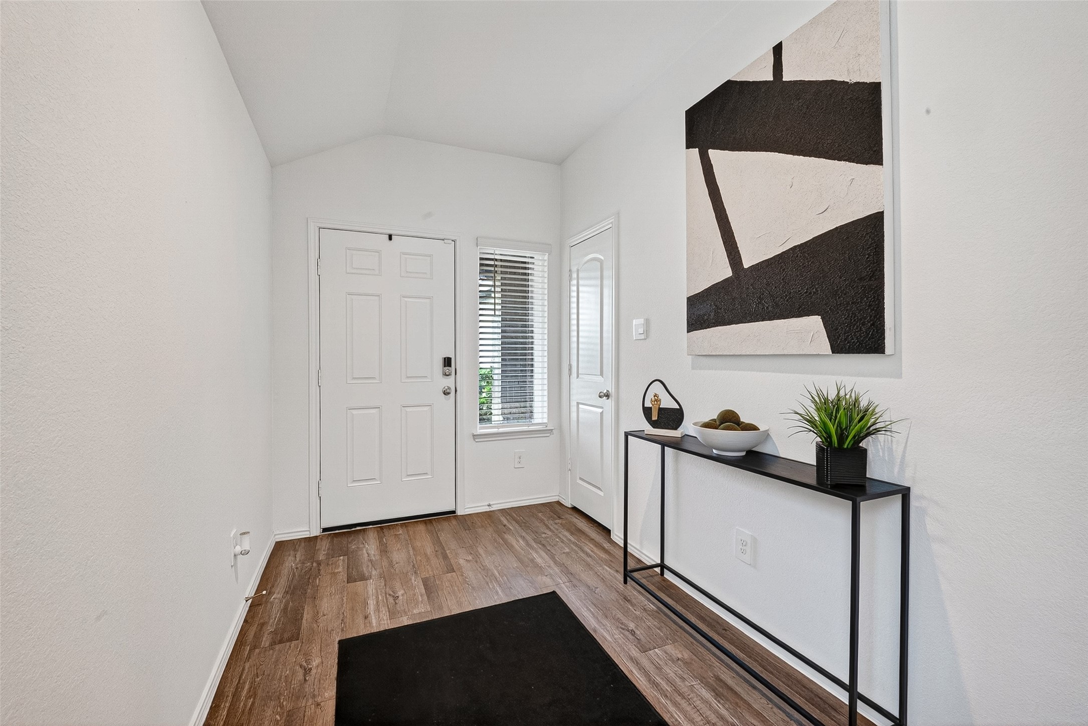 24318 Pebble Crescent Ln Spring Spring, TX 77373 - Photo 5 of 30 Inviting entryway with a warm and welcoming atmosphere, offering the perfect first impression with stylish finishes and an open flow into the main living spaces.