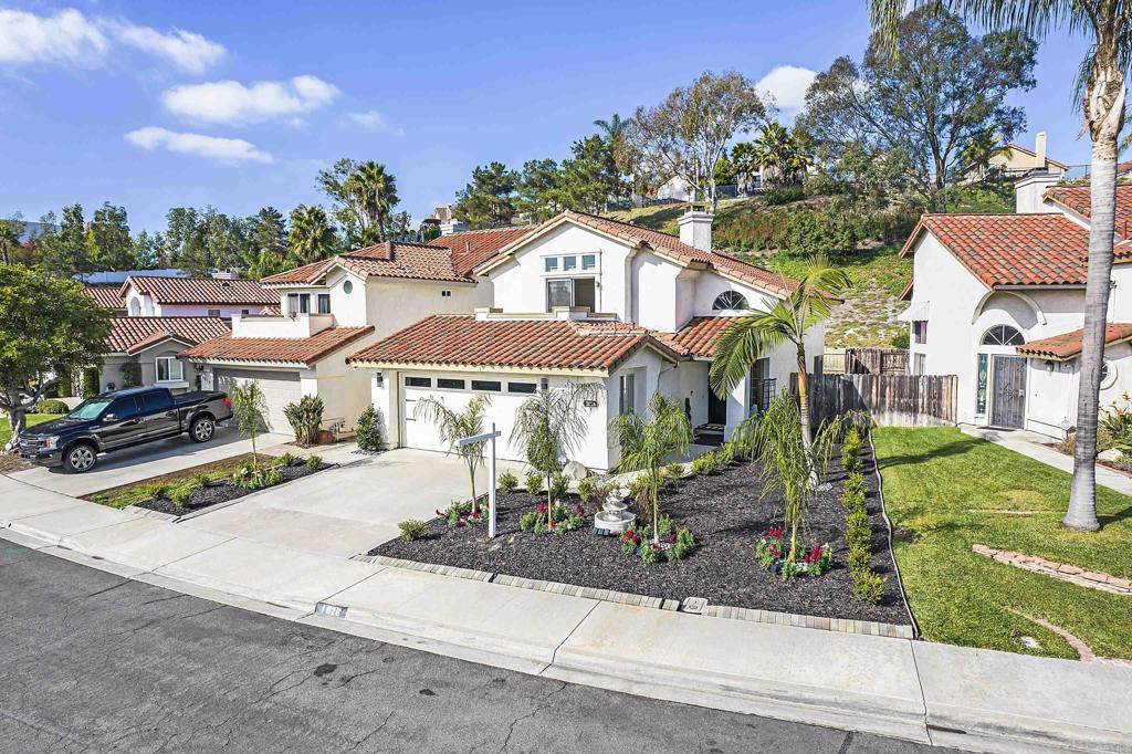 1826 Avenida Sevilla Oceanside, CA 92056 - Photo 1 of 34 a front view of a house with garden