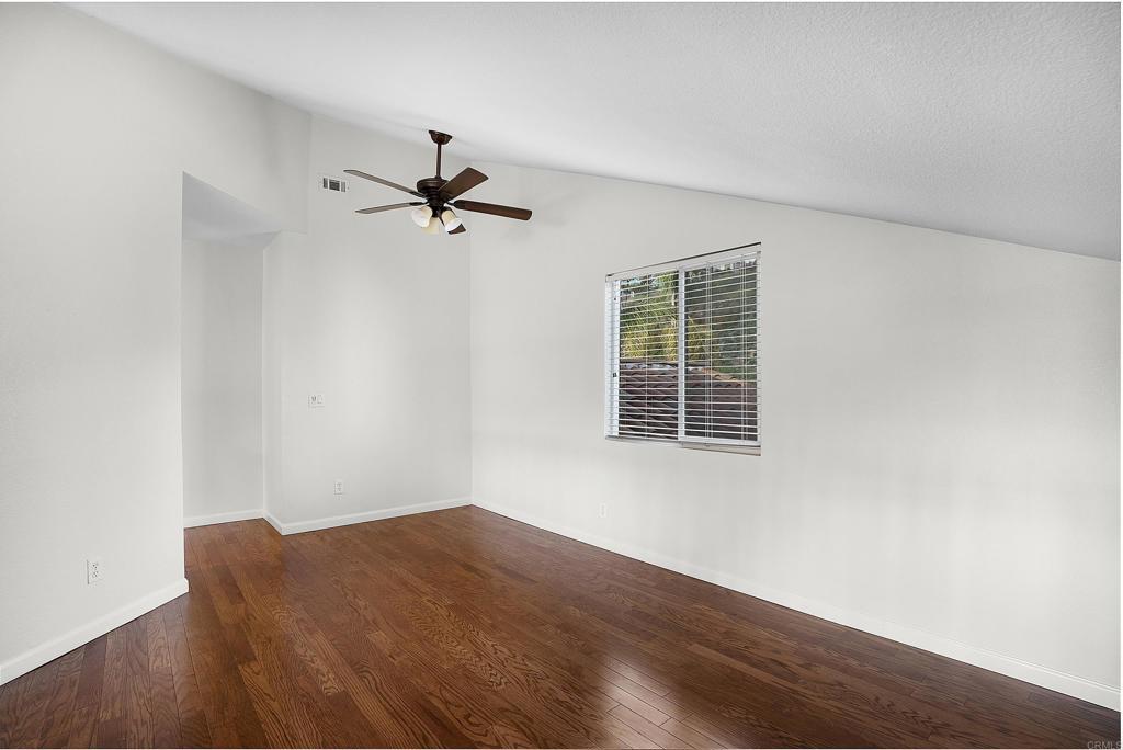 1826 Avenida Sevilla Oceanside, CA 92056 - Photo 24 of 34 an empty room with a window and a ceiling fan
