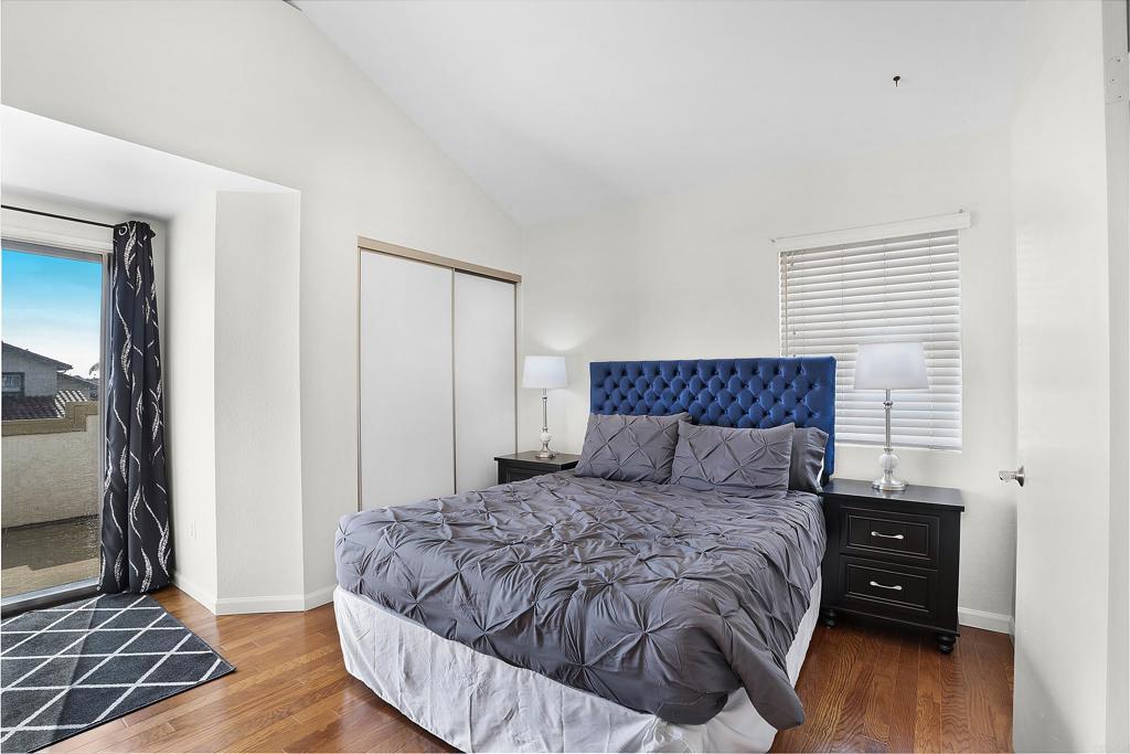 1826 Avenida Sevilla Oceanside, CA 92056 - Photo 25 of 34 a bedroom with a bed and wooden floor