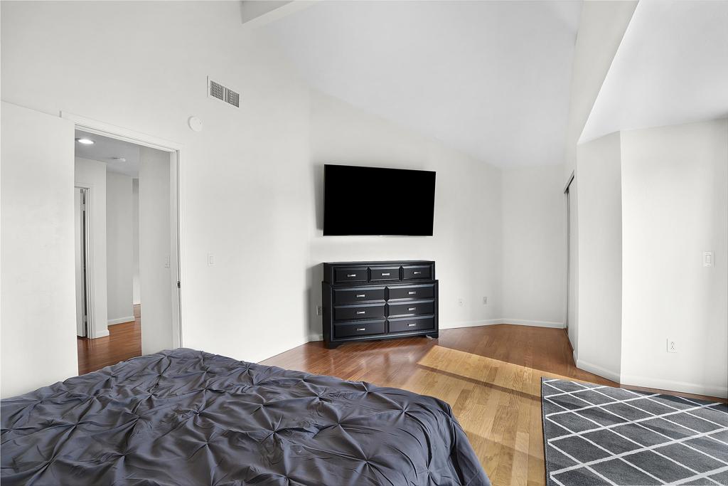 1826 Avenida Sevilla Oceanside, CA 92056 - Photo 26 of 34 a bedroom with a bed and a flat screen tv
