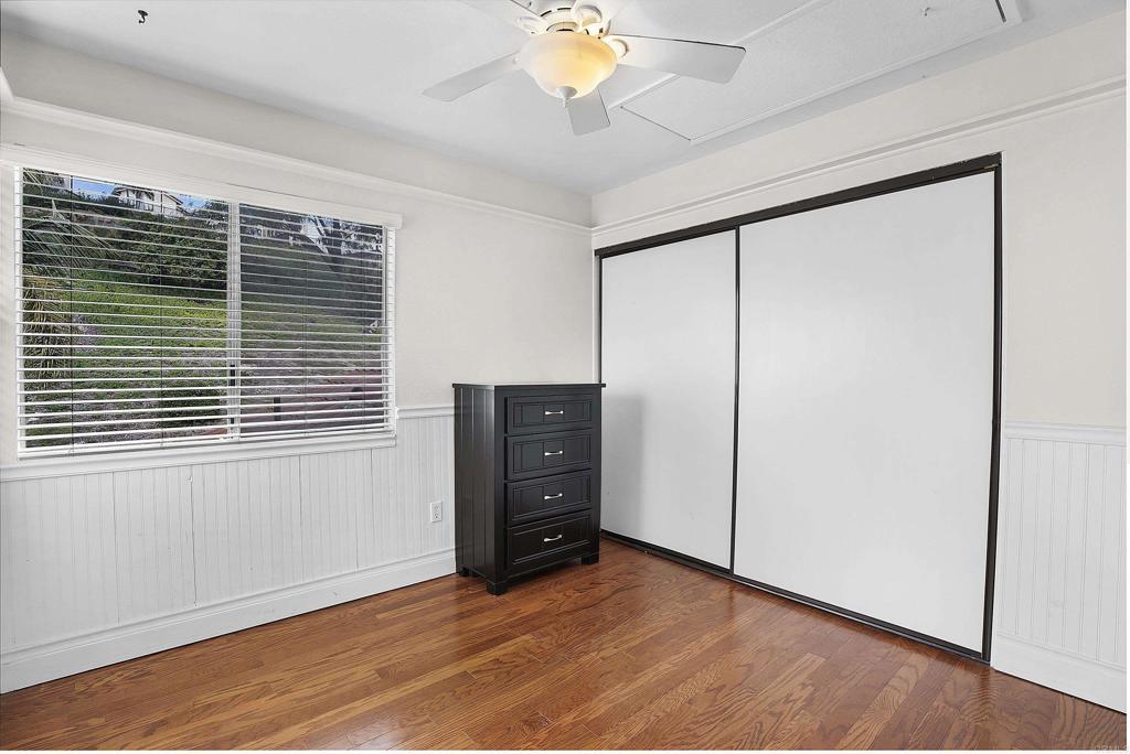 1826 Avenida Sevilla Oceanside, CA 92056 - Photo 32 of 34 a view of an empty room with a window and wooden floor