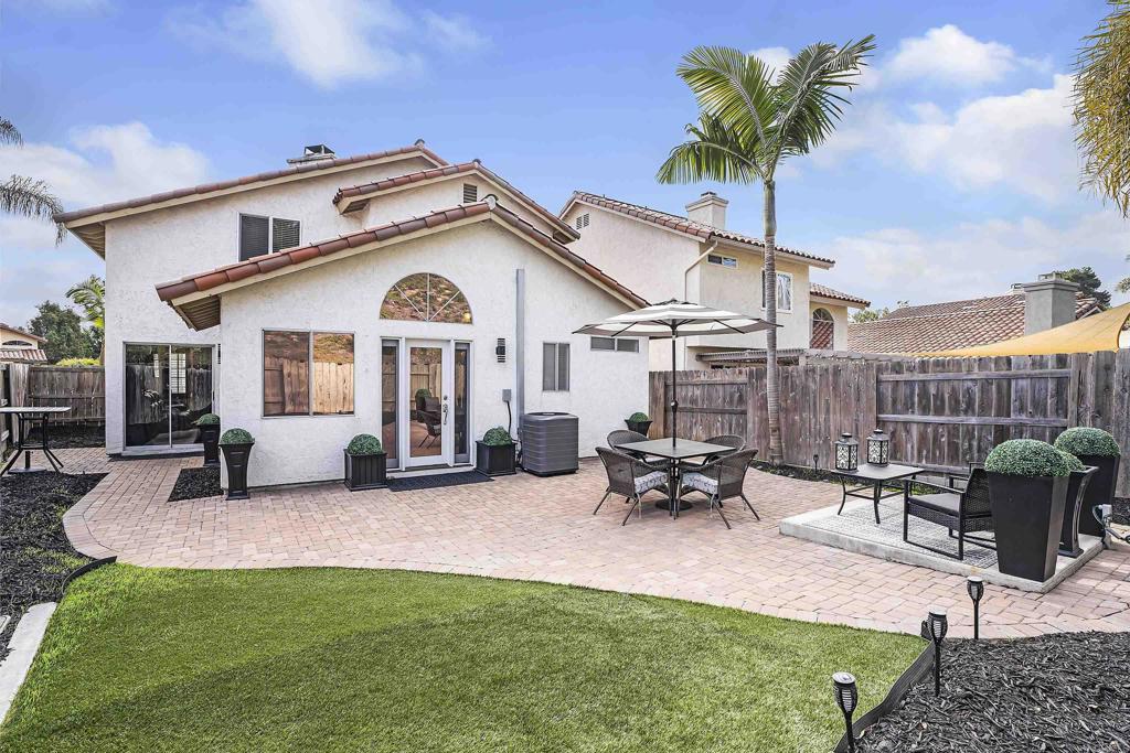 1826 Avenida Sevilla Oceanside, CA 92056 - Photo 7 of 34 a view of a house with patio and a garden