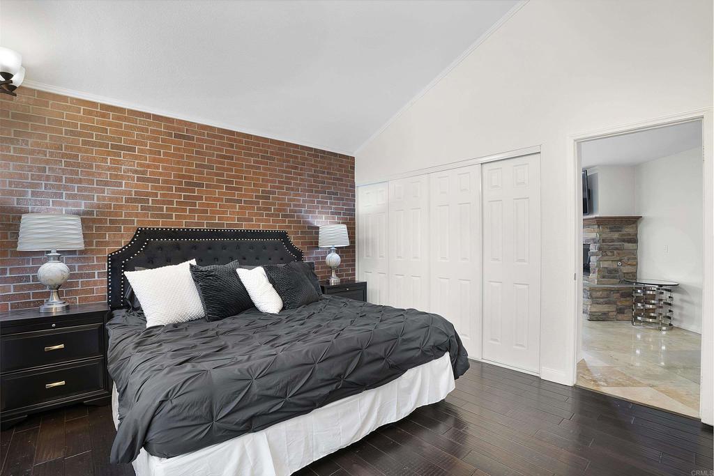 1826 Avenida Sevilla Oceanside, CA 92056 - Photo 9 of 34 a bedroom with a bed and wooden floor