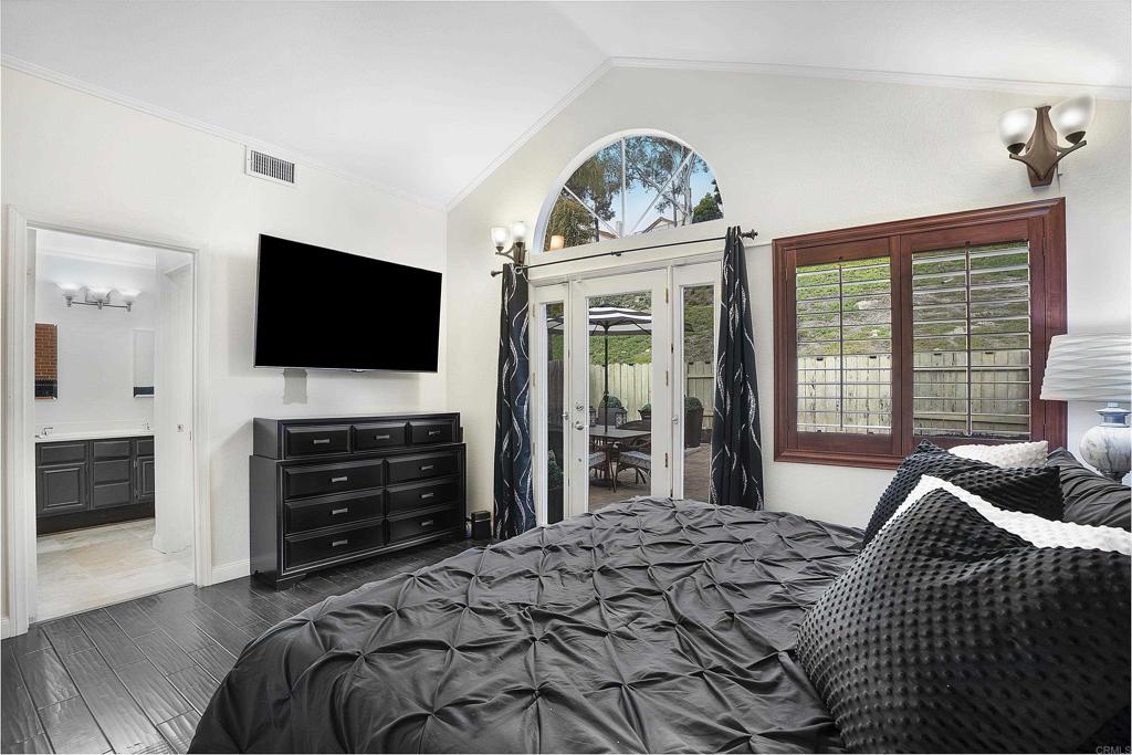 1826 Avenida Sevilla Oceanside, CA 92056 - Photo 10 of 34 a bedroom with a bed and a flat screen tv