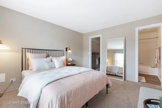 a bedroom with bed and a window