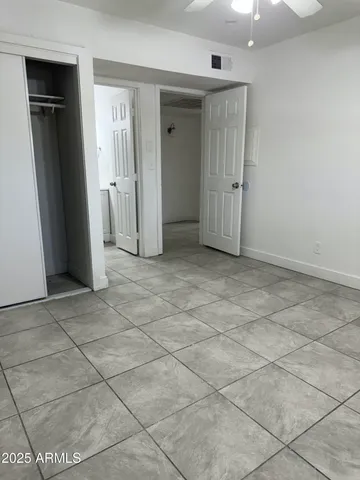 a view of a kitchen with a sink and cabinets