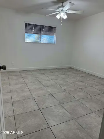 a kitchen with a refrigerator and cabinets