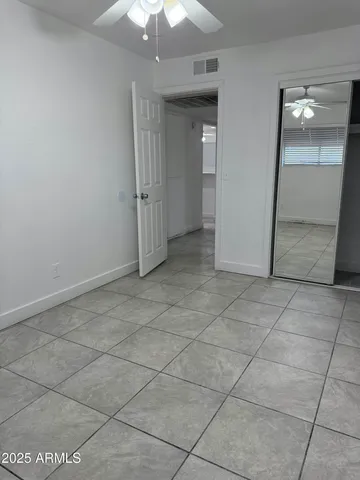 a bathroom with a toilet sink and shower