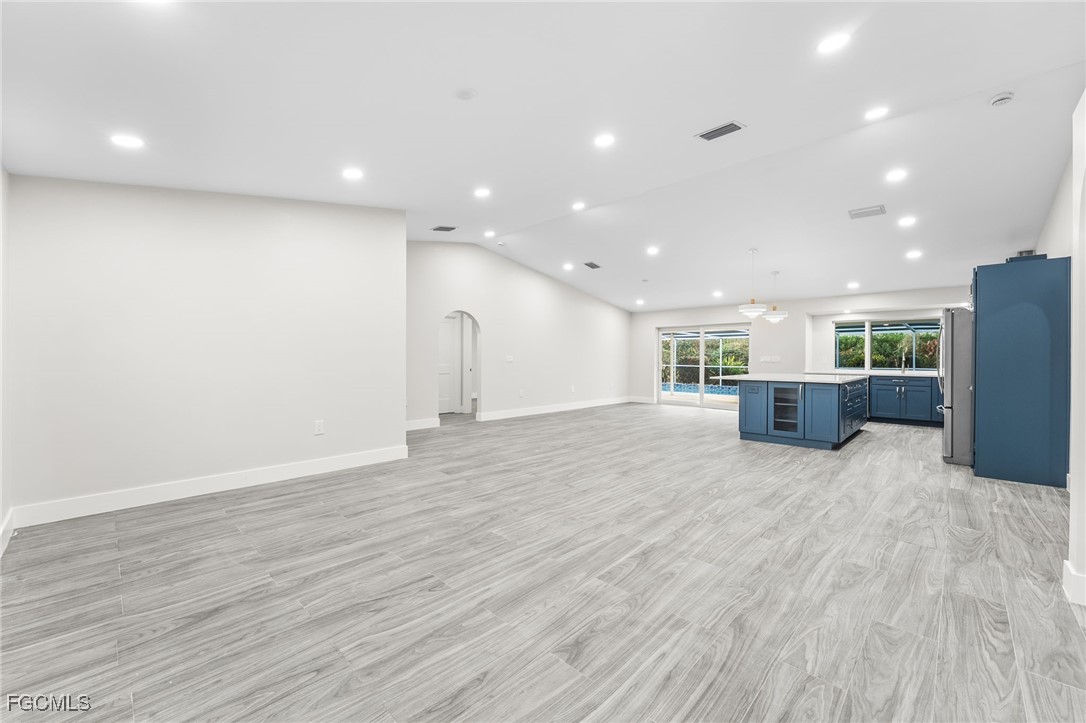 12860 Iona Road Fort Myers, FL 33908 - Photo 20 of 44 a view of kitchen and a window with wooden floor