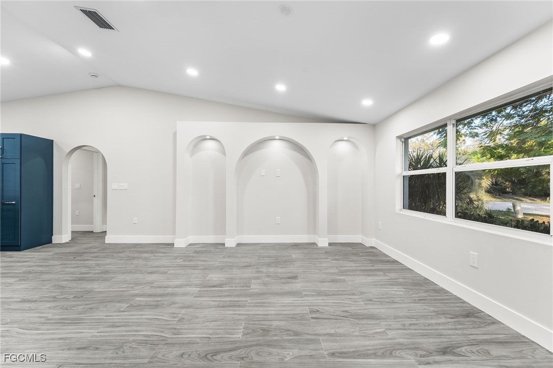 12860 Iona Road Fort Myers, FL 33908 - Photo 23 of 44 a view of a livingroom with wooden floor and window